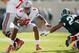 EAST LANSING, MI - SEPTEMBER 29: Braxton Miller #5 of the Ohio State Buckeyes looks to get around the tackle of Denicos Allen #28 of the Michigan State Spartans at Spartan Stadium on September 29, 2012 in East Lansing, Michigan. Ohio State won the game 17-16. (Photo by Gregory Shamus/Getty Images)