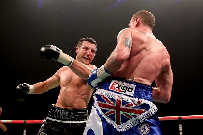Hi-res-451609415-carl-froch-in-action-with-george-groves-during-their_crop_north