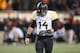 STILLWATER, OK - NOVEMBER 23: Bryce Petty #14 of the Baylor Bears walks off the field after Tyler Patmon #26 of the Oklahoma State Cowboys returned a fumble for a touchdown in the fourth quarter at Boone Pickens Stadium on November 23, 2013 in Stillwater, Oklahoma. (Photo by Ronald Martinez/Getty Images)