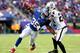 EAST RUTHERFORD, NJ - NOVEMBER 10: Andre Brown #35 of the New York Giants carries the ball as Charles Woodson #24 of the Oakland Raiders defends at MetLife Stadium on November 10, 2013 in East Rutherford, New Jersey.The New York Giants defeated the Oakland Raiders 24-20. (Photo by Elsa/Getty Images)