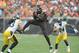 Nov 24, 2013; Cleveland, OH, USA; Cleveland Browns wide receiver Josh Gordon (12) makes a catch as Pittsburgh Steelers strong safety Troy Polamalu (43) and Pittsburgh Steelers cornerback Ike Taylor (24) defend during the second quarter at FirstEnergy Stadium. Mandatory Credit: Ken Blaze-USA TODAY Sports