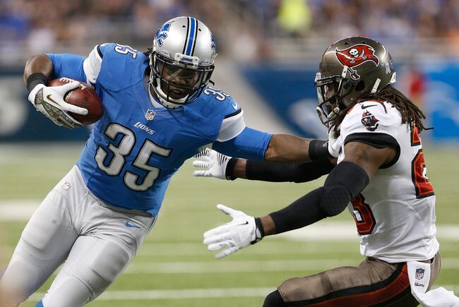 Hi-res-451759601-joique-bell-of-the-detroit-lions-stiff-arms-mark-barron_crop_north