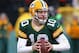 GREEN BAY, WI - NOVEMBER 24: Matt Flynn #10 of the Green Bay Packers rolls out to look for a receiver against the Minnesota Vikings at Lambeau Field on November 24, 2013 in Green Bay, Wisconsin. The Vikings and the Packers tied 26-26 after overtime. (Photo by Jonathan Daniel/Getty Images)