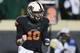 STILLWATER, OK - NOVEMBER 23: Clint Chelf #10 of the Oklahoma State Cowboys celebrates a touchdown against the Baylor Bears in the third quarter at Boone Pickens Stadium on November 23, 2013 in Stillwater, Oklahoma. (Photo by Ronald Martinez/Getty Images)