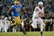 PASADENA, CA - NOVEMBER 23: Taylor Kelly #10 of the Arizona State Sun Devils scrambles in the pocket away from Ellis McCarthy #90 of the UCLA Bruins during the second quarter at Rose Bowl on November 23, 2013 in Pasadena, California. (Photo by Harry How/Getty Images)