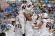 PASADENA, CA - NOVEMBER 23: Taylor Kelly #10 of the Arizona State Sun Devils celebrates his touchdown run with Jamil Douglas #74 for a 7-0 lead over UCLA Bruins during the first quarter at Rose Bowl on November 23, 2013 in Pasadena, California. (Photo by Harry How/Getty Images)