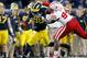 ANN ARBOR, MI - NOVEMBER 09: Devin Gardner #98 of the Michigan Wolverines is dragged down by Avery Moss #94 of the Nebraska Cornhuskers in the second quarter at Michigan Stadium on November 9, 2013 in Ann Arbor, Michigan. (Photo by Gregory Shamus/Getty Images)