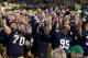 Oct 19, 2013; South Bend, IN, USA; Notre Dame Fighting Irish offensive tackle Zack Martin (70), nose tackle Louis Nix (1), defensive lineman Marquis Dickerson (95), and nose tackle Kona Schwenke (96) sing the Notre Dame Alma Mater after Notre Dame defeated the USC Trojans 14-10 at Notre Dame Stadium. Mandatory Credit: Matt Cashore-USA TODAY Sports