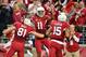 Nov 24, 2013; Phoenix, AZ, USA; Arizona Cardinals wide receiver Larry Fitzgerald (11) celebrates with tight end Jim Dray (81) and wide receiver Michael Floyd (15) after catching a 26 yard touchdown during the first half against the Indianapolis Colts at University of Phoenix Stadium. Mandatory Credit: Matt Kartozian-USA TODAY Sports