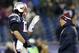 Nov 24, 2013; Foxborough, MA, USA; New England Patriots quarterback Tom Brady (12) talks with head coach Bill Belichick during warm-ups before the game against the Denver Broncos at Gillette Stadium Stadium. Mandatory Credit: Greg M. Cooper-USA TODAY Sports