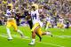 BATON ROUGE, LA - NOVEMBER 23: Running Back Terrence Magee #14 of the LSU TIgiers rushes for a first down against the Texas A&M Aggies at Tiger Stadium on November 23, 2013 in Baton Rouge, Louisiana. (Photo by Sean Gardner/Getty Images)