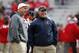 Oct 5, 2013; Lincoln, NE, USA; Nebraska Cornhuskers head coach Bo Pelini and Illinois Fighting Illini head coach Tim Beckman talk before the game at Memorial Stadium. Mandatory Credit: Bruce Thorson-USA TODAY Sports
