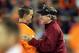 Clemson coach Dabo Swinney (left) and South Carolina coach Steve Spurrier are opposed to tossing a few verbal jabs.