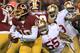 LANDOVER, MD - NOVEMBER 25: Quarterback Robert Griffin III #10 of the Washington Redskins runs the ball as outside linebacker Ahmad Brooks #55 of the San Francisco 49ers rushes in in the first quarter at FedExField on November 25, 2013 in Landover, Maryland. (Photo by Rob Carr/Getty Images)