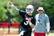 May 14, 2013; Tempe, AZ, USA; Arizona Cardinals quarterback Carson Palmer (3) throws a pass as head coach Bruce Arians looks on during organized team activities at the Cardinals Training Facility. Mandatory Credit: Matt Kartozian-USA TODAY Sports