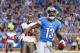 DETROIT, MI - NOVEMBER 24: Nate Burleson #13 of the Detroit Lions celebrates after scoring a touchdown on an 11 yard pass from quarterback Matthew Stafford #9 during the game against the Tampa Bay Buccaneers at Ford Field on November 24, 2013 in Detroit, Michigan. (Photo by Leon Halip/Getty Images)
