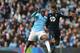 MANCHESTER, ENGLAND - NOVEMBER 24: Yaya Toure of Manchester City challenges Paulinho of Tottenham Hotspur during the Barclays Premier League match between Manchester City and Tottenham Hotspur at Etihad Stadium on November 24, 2013 in Manchester, England. (Photo by Jamie McDonald/Getty Images)