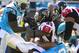 Nov 3, 2013; Charlotte, NC, USA; Atlanta Falcons running back Steven Jackson (39) is tackled by Carolina Panthers defensive end Charles Johnson (95) and defensive tackle Star Lotulelei (98) in the first quarter at Bank of America Stadium. Mandatory Credit: Bob Donnan-USA TODAY Sports