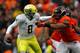 CORVALLIS, OR - NOVEMBER 24: Marcus Mariota #8 of the Oregon Ducks is pressured by Scott Crichton #95 of the Oregon State Beavers during the 116th Civil War on November 24, 2012 at the Reser Stadium in Corvallis, Oregon. (Photo by Jonathan Ferrey/Getty Images)