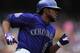 DENVER, CO - JUNE 13: Dexter Fowler #24 of the Colorado Rockies doubles to lead off the first inning against starting pitcher Ross Detwiler #48 of the Washington Nationals at Coors Field on June 13, 2013 in Denver, Colorado. (Photo by Doug Pensinger/Getty Images)