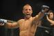 Jan 12, 2013; Oklahoma City, OK, USA; Tarec Saffiedine (red and black shorts) celebrates after his match with Nate Marquardt (not shown) in their Strikeforce MMA Welterweight Title bout at the Chesapeake Energy Arena. Mandatory Credit: Mark D. Smith-USA TODAY Sports