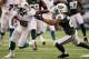 EAST RUTHERFORD, NJ - OCTOBER 28: Wide receiver Davone Bess #15 of the Miami Dolphins avoids a tackle by cornerback Kyle Wilson #20 of the New York Jets at MetLife Stadium on October 28, 2012 in East Rutherford, New Jersey. (Photo by Alex Trautwig/Getty Images)