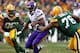 GREEN BAY, WI - NOVEMBER 24: Adrian Peterson #28 of the Minnesota Vikings runs between Mike Daniels #76 and Mike Neal #96 of the Green Bay Packers at Lambeau Field on November 24, 2013 in Green Bay, Wisconsin. The Vikings tied the Packers 26-26 after overtime. (Photo by Jonathan Daniel/Getty Images)