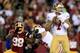 LANDOVER, MD - NOVEMBER 25: Quarterback Colin Kaepernick #7 of the San Francisco 49ers looks to pass as outside linebacker Brian Orakpo #98 of the Washington Redskins rushes in in the first quarter at FedExField on November 25, 2013 in Landover, Maryland. (Photo by Rob Carr/Getty Images)