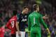 CARDIFF, WALES - NOVEMBER 24: Manchester United player Jonny Evans has words with goalkeeper David de Gea during the Barclays Premier League match between Cardiff City and Manchester United at Cardiff City Stadium on November 24, 2013 in Cardiff, Wales. (Photo by Stu Forster/Getty Images)