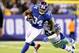 EAST RUTHERFORD, NJ - NOVEMBER 24: Brandon Jacobs #34 of the New York Giants carries the ball as Ernie Sims #59 of the Dallas Cowboys tries to make the tackle at MetLife Stadium on November 24, 2013 in East Rutherford, New Jersey.The Dallas Cowboys defeated the New York Giants 24-21. (Photo by Elsa/Getty Images)