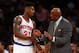 NEW YORK, NY - MARCH 31: Iman Shumpert #21 talks with head coach Mike Woodson of the New York Knicks during a time out against the Boston Celtics on March 31, 2013 at Madison Square Garden in New York City. NOTE TO USER: User expressly acknowledges and agrees that, by downloading and/or using this photograph, user is consenting to the terms and conditions of the Getty Images License Agreement. (Photo by Elsa/Getty Images)