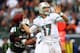 EAST RUTHERFORD, NJ - OCTOBER 28: Ryan Tannehill #17 of the Miami Dolphins drops back to pass as Bryan Thomas #58 of the New York Jets defends on October 28, 2012 at MetLife Stadium in East Rutherford, New Jersey. (Photo by Elsa/Getty Images)