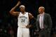 Oct 15, 2013; Brooklyn, NY, USA; Brooklyn Nets small forward Paul Pierce (34) talks to head coach Jason Kidd in the fourth quarter of pre-season NBA game against the boston Celtics at Barclays Center. Mandatory Credit: Noah K. Murray-USA TODAY Sports