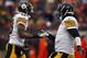 CLEVELAND, OH - NOVEMBER 24: Wide receiver Emmanuel Sanders #88 of the Pittsburgh Steelers celebrates with quarterback Ben Roethlisberger #7 after catching a touchdown pass against the Cleveland Browns at FirstEnergy Stadium on November 24, 2013 in Cleveland, Ohio. (Photo by Matt Sullivan/Getty Images)
