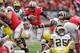 COLUMBUS, OH - NOVEMBER 24: Quarterback Braxton Miller #5 of the Ohio State Buckeyes controls the ball against the Michigan Wolverines at Ohio Stadium on November 24, 2012 in Columbus, Ohio. (Photo by Jamie Sabau/Getty Images)