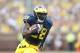 ANN ARBOR, MI - OCTOBER 05: Fitzgerald Toussaint #28 of the Michigan Wolverines runs eight yards for a first quarter touchdown during the game against the Minnesota Golden Gophers at Michigan Stadium on October 5, 2013 in Ann Arbor, Michigan. (Photo by Leon Halip/Getty Images)
