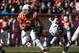 Nov 24, 2012; Blacksburg, VA, USA; Virginia Tech Hokies quarterback Logan Thomas (3) rushes the ball after Virginia Cavaliers defensive end Mike Moore (32) missed a tackled during the first half at Lane Stadium. Mandatory Credit: Peter Casey-USA TODAY Sports