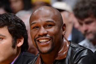 Hi-res-450371531-boxer-floyd-mayweather-attends-a-game-between-the_crop_north