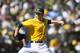 OAKLAND, CA - SEPTEMBER 22: Brett Anderson #49 of the Oakland Athletics pitches against the Minnesota Twins during the sixth inning at O.co Coliseum on September 22, 2013 in Oakland, California. (Photo by Jason O. Watson/Getty Images)