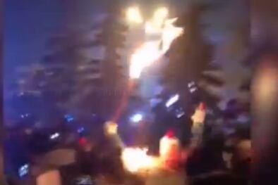 Olympic Flame Lights Torchbearer's Jacket on Fire
