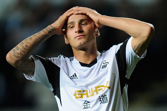 Hi-res-185728812-swansea-player-jonjo-shelvey-reacts-after-a-miss-during_crop_north