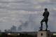 LONDON, ENGLAND - AUGUST 09: Smoke is seen over north London from a view behind the Bobby Moore statue outside Wembley Stadium as the England v Netherlands game is called off at Wembley Stadium following a night of rioting on August 9, 2011 in London, England. Widespread looting, arson and clashes with police continued for a third day in parts of the capital, as well as in Liverpool, Birmingham and Bristol, as fears grow that it will carry into a fourth night. (Photo by Julian Finney/Getty Images)