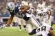ARLINGTON, TX - NOVEMBER 28: Dez Bryant #88 of the Dallas Cowboys is tackled by Phillip Adams #28 of the Oakland Raiders at AT&T Stadium on November 28, 2013 in Arlington, Texas. (Photo by Ronald Martinez/Getty Images)