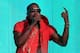 LOS ANGELES, CA - FEBRUARY 20: Rapper Kanye West performs during the 2011 NBA All-Star game halftime show at Staples Center on February 20, 2011 in Los Angeles, California. NOTE TO USER: User expressly acknowledges and agrees that, by downloading and or using this photograph, User is consenting to the terms and conditions of the Getty Images License Agreement. (Photo by Jeff Gross/Getty Images)