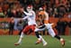 DENVER, CO - NOVEMBER 17: Alex Smith #11 of the Kansas City Chiefs passes against the defense of Wesley Woodyard #52 of the Denver Broncos in the first half at Sports Authority Field at Mile High on November 17, 2013 in Denver, Colorado. (Photo by Doug Pensinger/Getty Images)