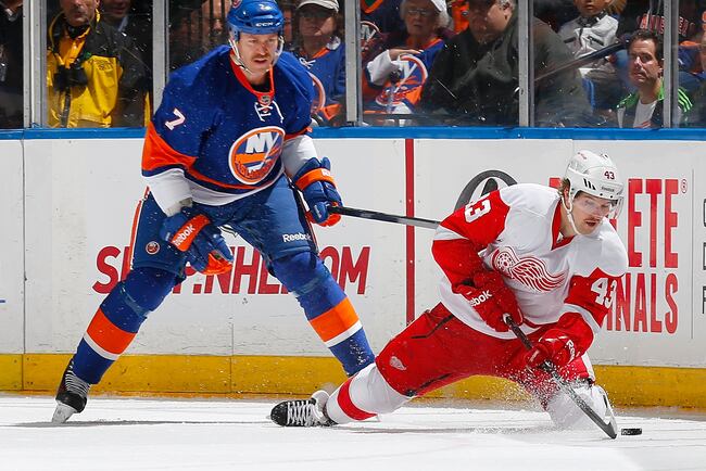 Hi-res-452521283-darren-helm-of-the-detroit-red-wings-shoots-the-puck_crop_north