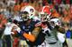 AUBURN, AL - NOVEMBER 16: Nick Marshall #14 of the Auburn Tigers is pursued by Ramik Wilson #51 of the Georgia Bulldogs at Jordan-Hare Stadium on November 16, 2013 in Auburn Alabama. (Photo by Scott Cunningham/Getty Images)