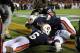 Nov 30, 2013; Auburn, AL, USA; Auburn Tigers cornerback Chris Davis (bottom) celebrates with defensive back Jonathon Mincy (6) and teammates after returning a missed field goal for a 100 yard touchdown during the fourth quarter at Jordan Hare Stadium. Auburn Tigers won 34-28. Mandatory Credit: Shanna Lockwood-USA TODAY Sports