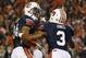 AUBURN, AL - NOVEMBER 30: Ryan Smith #24 of the Auburn Tigers yells to an official as he and Jonathan Jones #3 react after Smith recovered a blocked punt in the fourth quarter against the Alabama Crimson Tide at Jordan-Hare Stadium on November 30, 2013 in Auburn, Alabama. (Photo by Kevin C. Cox/Getty Images)