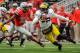 COLUMBUS, OH - NOVEMBER 24: Quarterback Devin Gardner #12 of the Michigan Wolverines tries to elude the tackle attempt of Ryan Shazier #10 of the Ohio State Buckeyes at Ohio Stadium on November 24, 2012 in Columbus, Ohio. (Photo by Jamie Sabau/Getty Images)